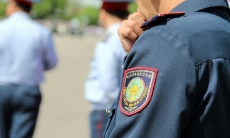 Police officers of Kazakhstan’s Nur-Sultan city inspect every yard and flat